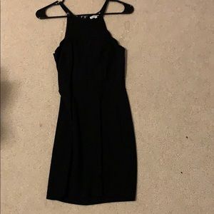 mini black dress with scalloped neckline